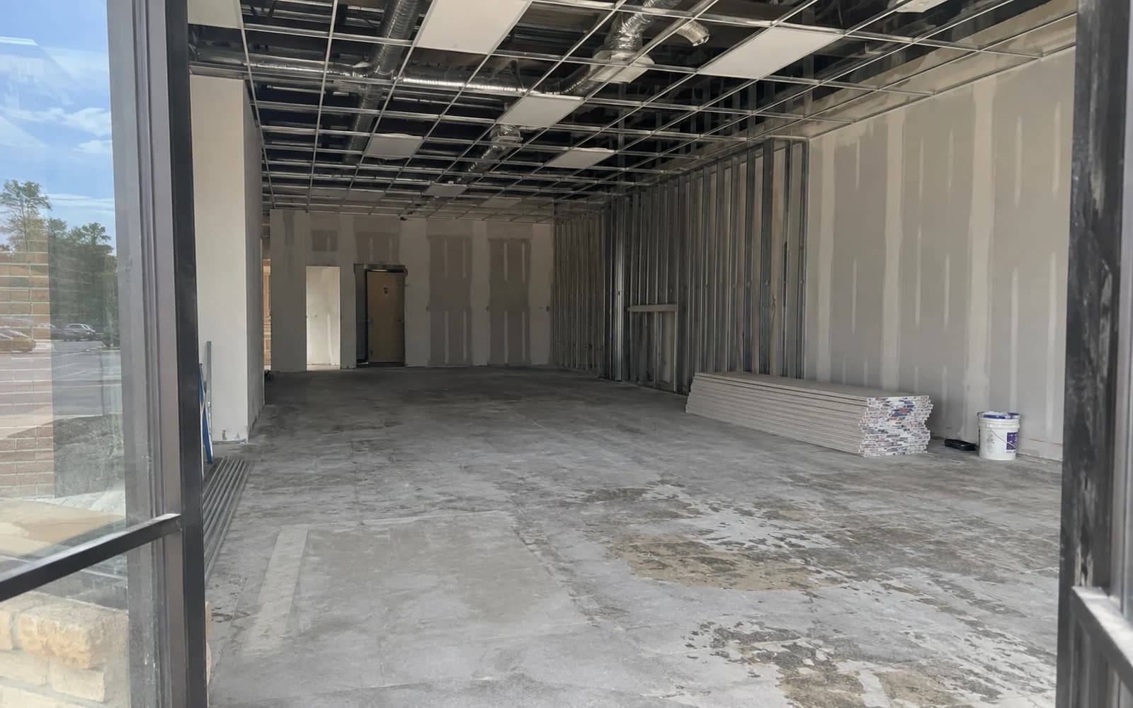 Small retail tenant renovation with drywall and ceiling rough-in